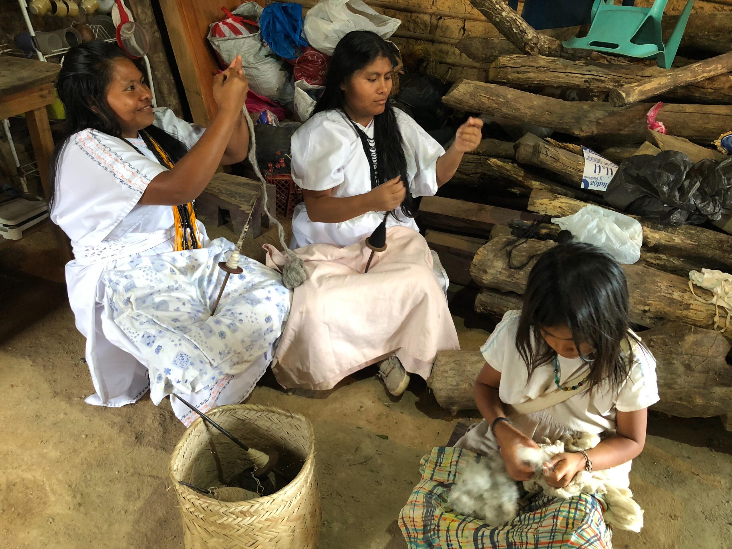 Spin the wool into thread using a cork